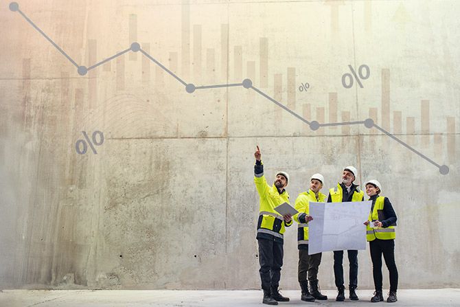 Construction crew holding blueprints