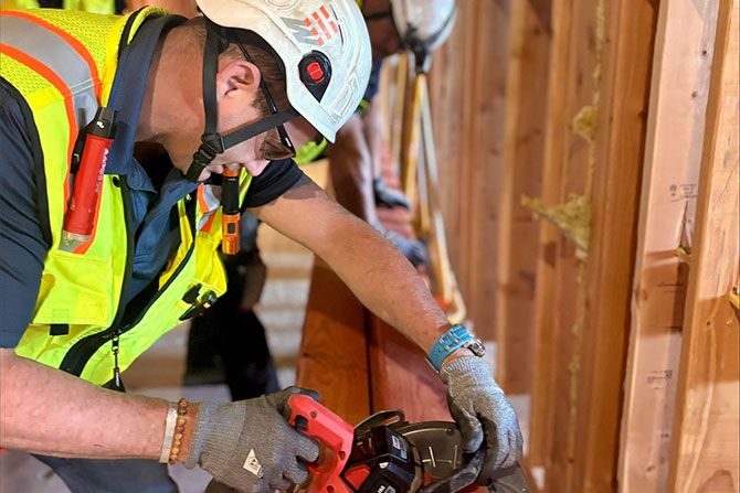Construction workers with saws